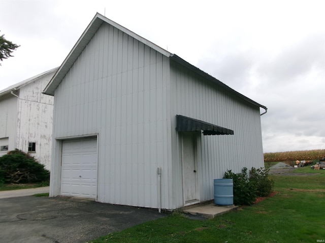 exterior space featuring a yard and a garage