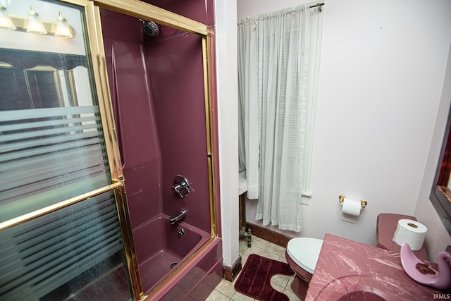 full bathroom with enclosed tub / shower combo, vanity, toilet, and tile patterned floors