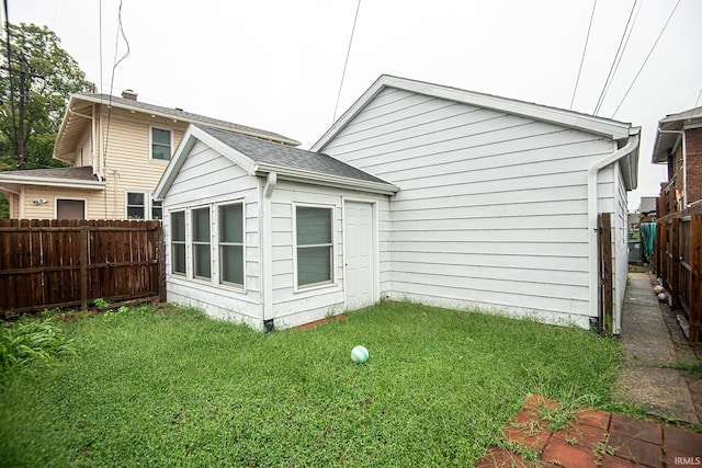 rear view of house with a lawn