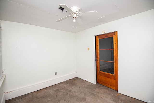 unfurnished room with concrete floors and ceiling fan