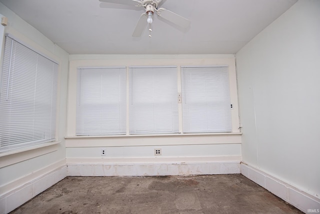 empty room featuring concrete flooring and ceiling fan