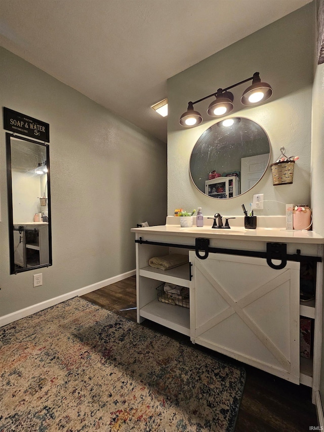 bathroom featuring vanity and hardwood / wood-style floors