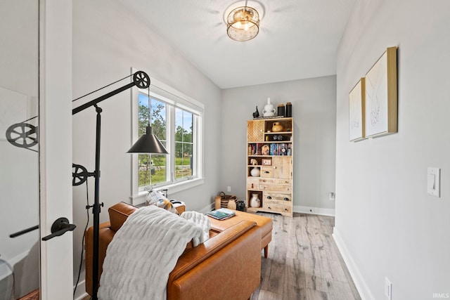 home office with a textured ceiling and hardwood / wood-style floors