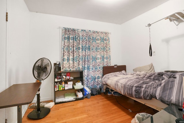 bedroom with wood-type flooring