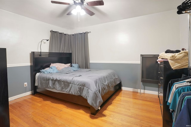 bedroom featuring light wood-type flooring and ceiling fan