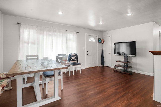 dining room with dark hardwood / wood-style flooring