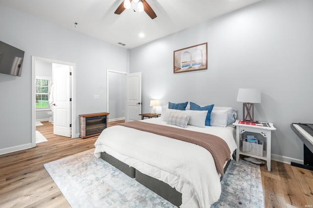 bedroom featuring ceiling fan and light hardwood / wood-style flooring