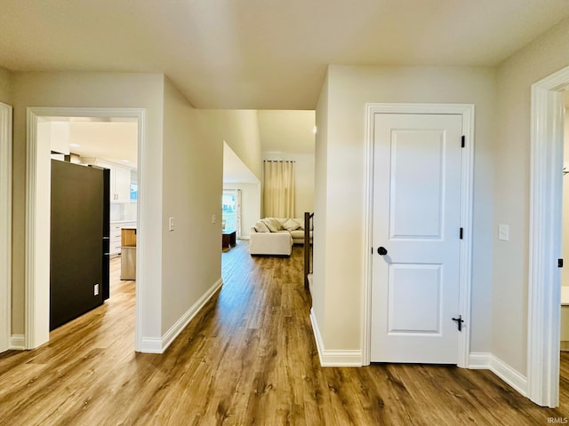 hallway with light wood-type flooring