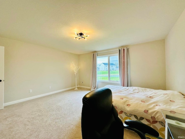 carpeted bedroom with a textured ceiling