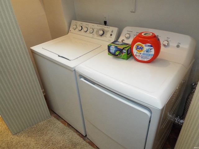 washroom featuring washing machine and dryer