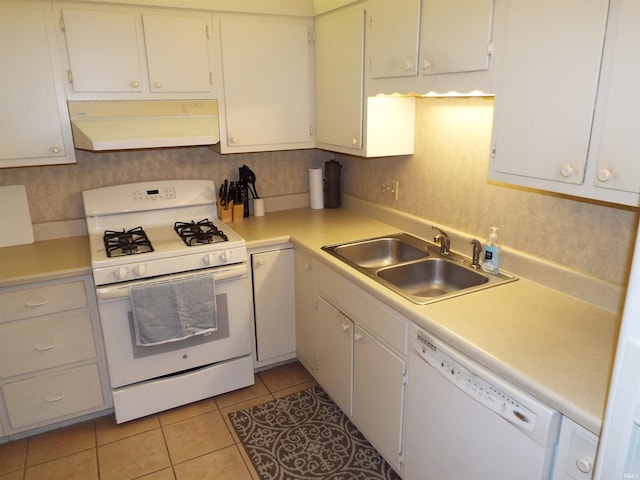 kitchen featuring white cabinets, light tile patterned floors, sink, white appliances, and ventilation hood