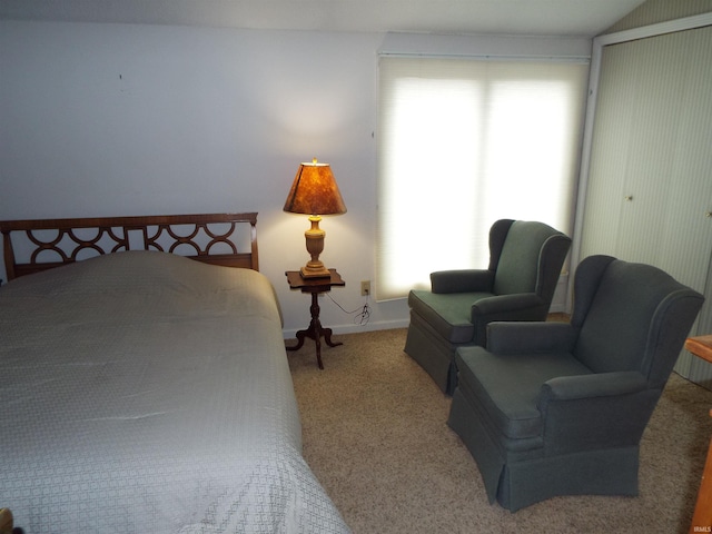 bedroom with light carpet and vaulted ceiling