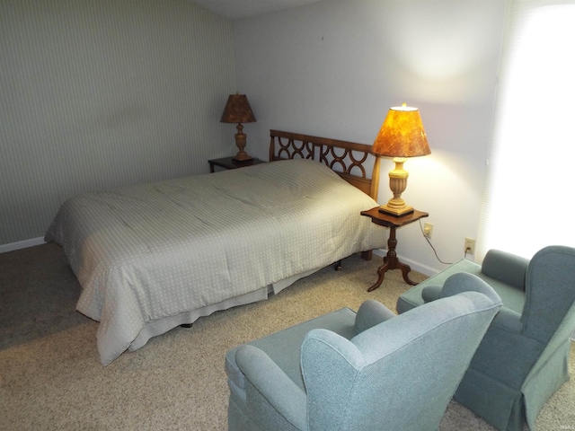 bedroom featuring light carpet