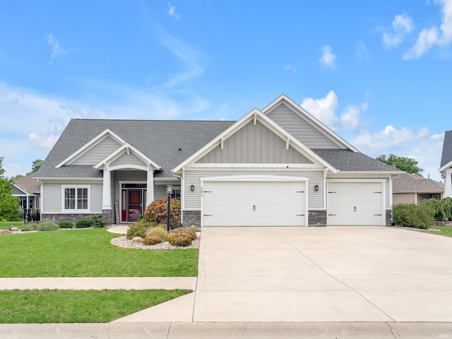 381 Elderwood Ct, Fort Wayne, IN 46845 - craftsman inspired home featuring a front yard, stone siding, a garage, board and batten siding, and concrete driveway