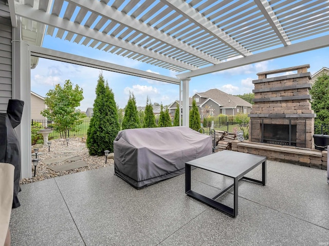 view of patio featuring a pergola, an outdoor stone fireplace, and a grill