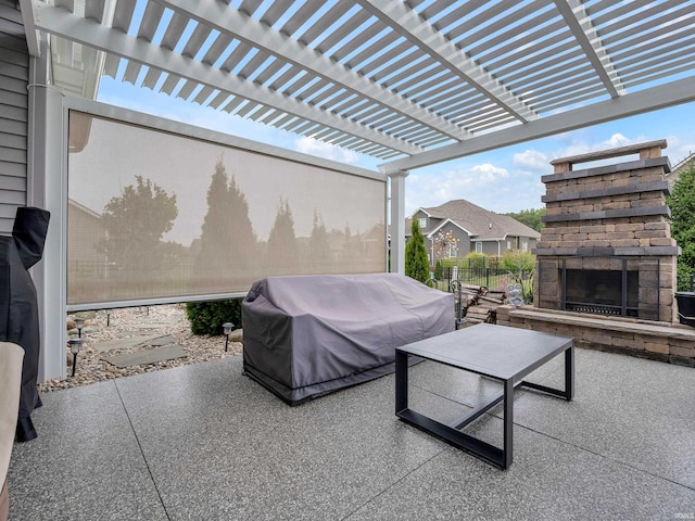 view of patio with a pergola, area for grilling, and an outdoor stone fireplace