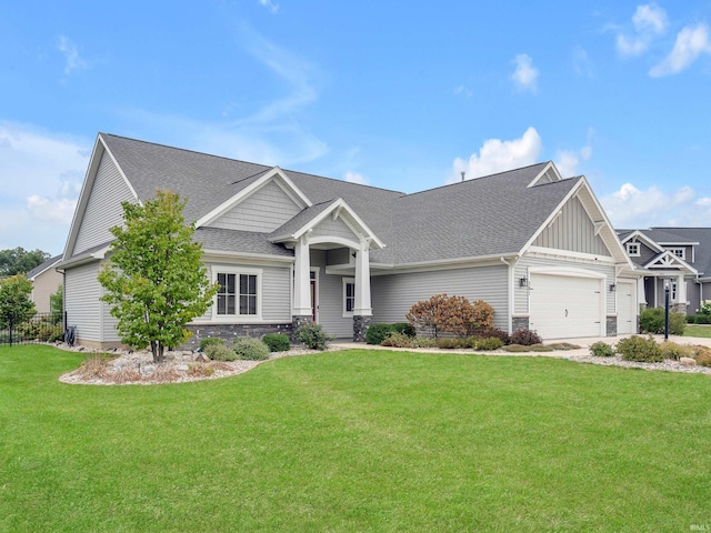 381 Elderwood Ct, Fort Wayne, IN 46845 - craftsman house featuring driveway, board and batten siding, a front lawn, a garage, and a shingled roof