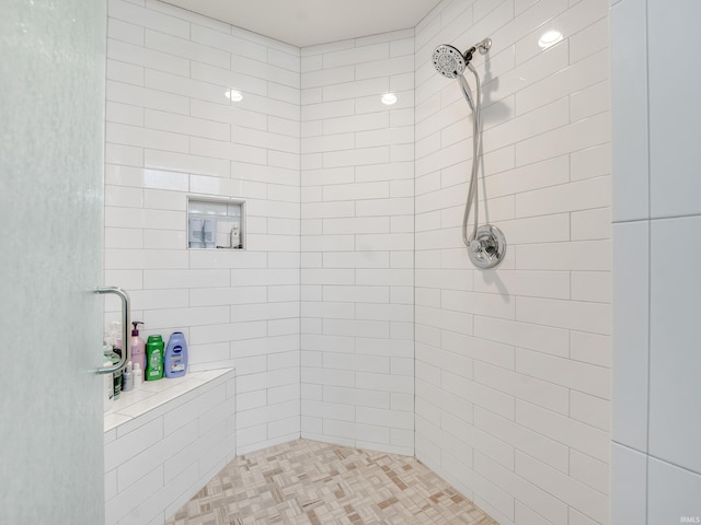 bathroom featuring tiled shower