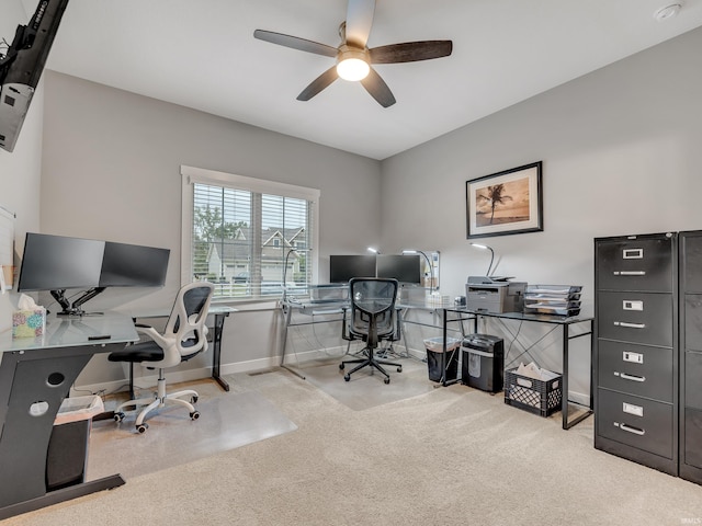 office space with ceiling fan and light colored carpet