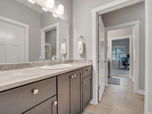 381 Elderwood Ct, Fort Wayne, IN 46845 - full bathroom featuring vanity, baseboards, and wood finished floors