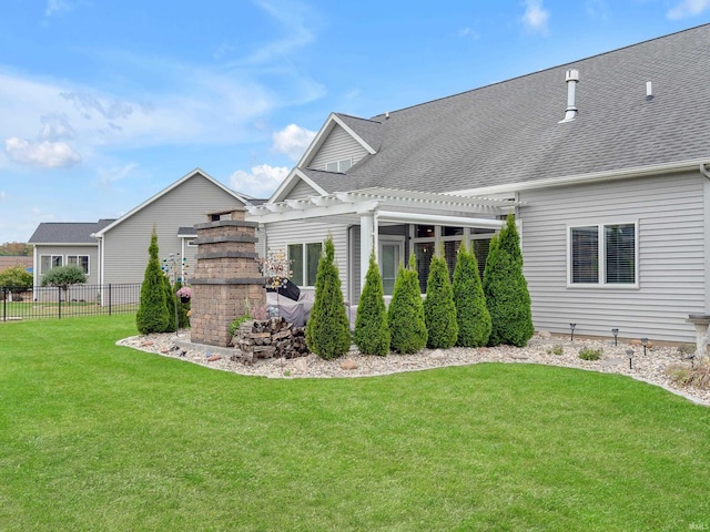 381 Elderwood Ct, Fort Wayne, IN 46845 - rear view of house featuring fence, a shingled roof, a lawn, and a pergola