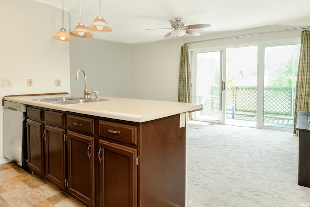 kitchen featuring hanging light fixtures, dishwasher, ceiling fan, sink, and light carpet