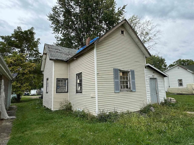 view of property exterior featuring a yard