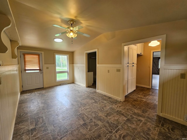 interior space featuring vaulted ceiling and ceiling fan