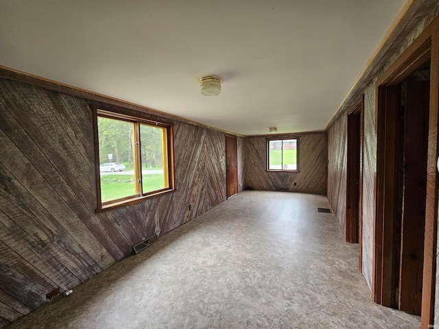 empty room with wood walls