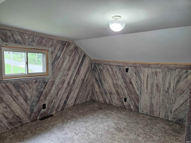 additional living space with lofted ceiling