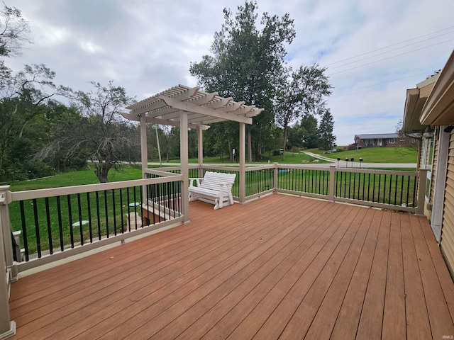 deck with a yard and a pergola