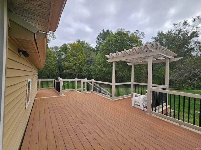 deck featuring a yard and a pergola