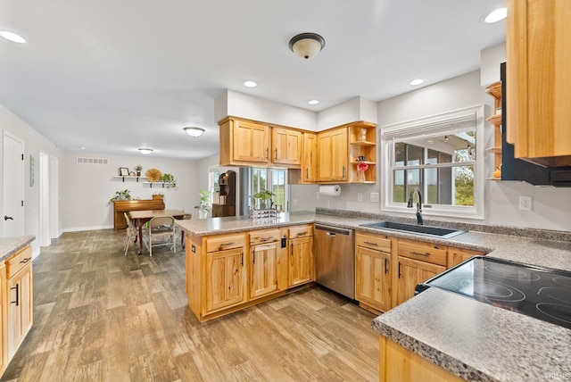 kitchen with light hardwood / wood-style flooring, stainless steel dishwasher, kitchen peninsula, and sink