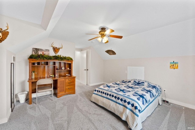 bedroom with ceiling fan, light colored carpet, and vaulted ceiling