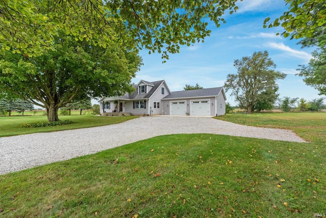 view of front of home featuring a front yard, a garage, and a porch