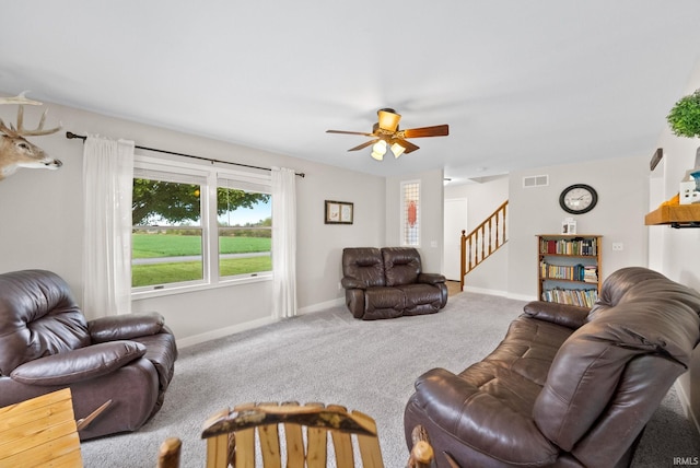 living room featuring ceiling fan and carpet floors