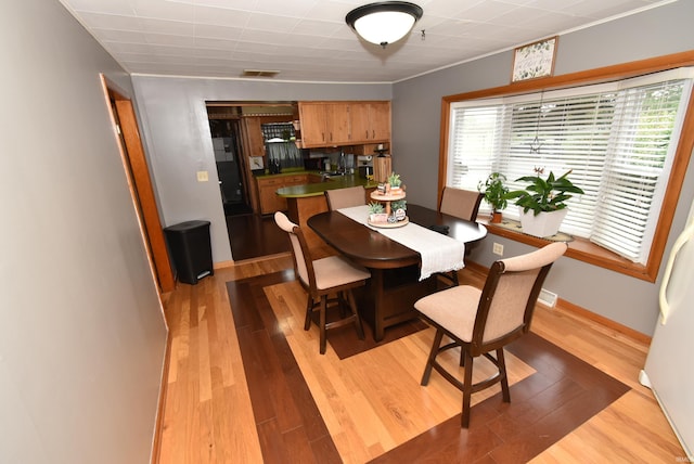 dining space featuring light hardwood / wood-style flooring