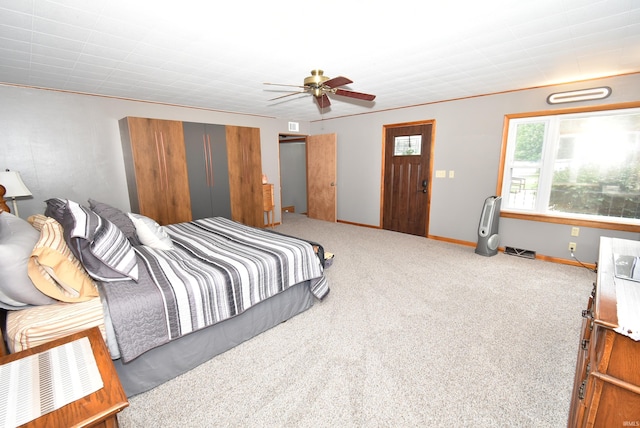 bedroom with ceiling fan and carpet floors