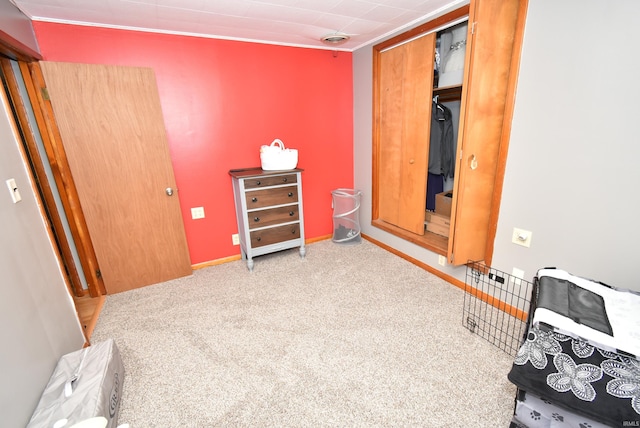 carpeted bedroom with a closet