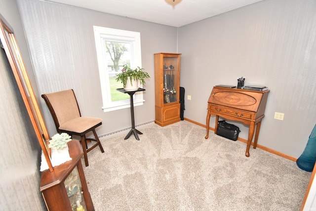 sitting room featuring light colored carpet