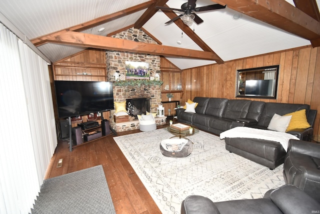 living room featuring lofted ceiling with beams, wood walls, a fireplace, dark hardwood / wood-style flooring, and ceiling fan