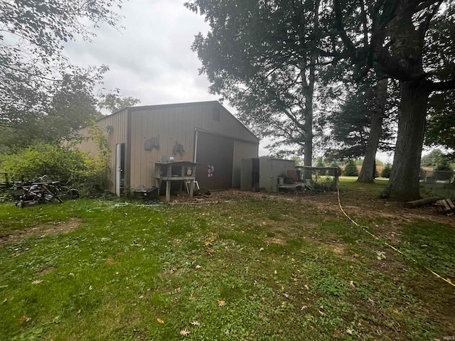 view of outbuilding with a lawn