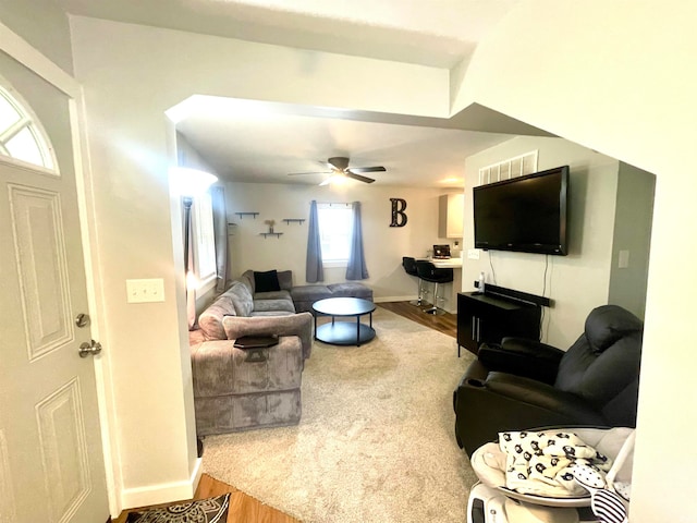 living room with ceiling fan and wood-type flooring