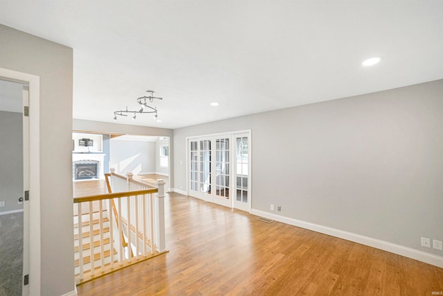 spare room featuring light wood-type flooring