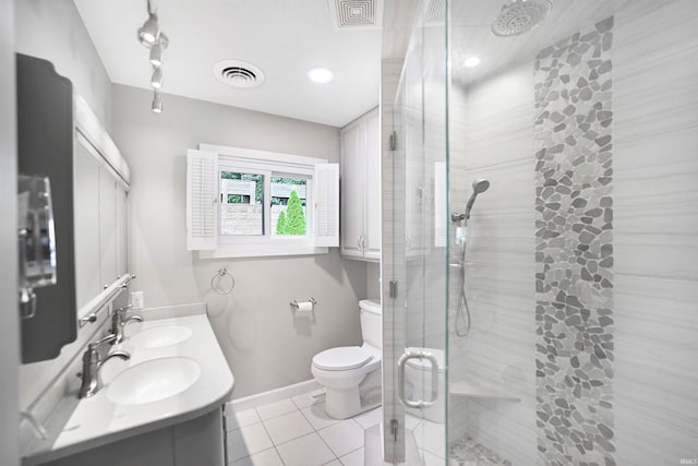 bathroom with toilet, tile patterned flooring, an enclosed shower, and vanity