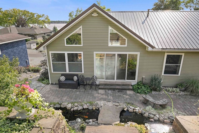 back of house with a patio area