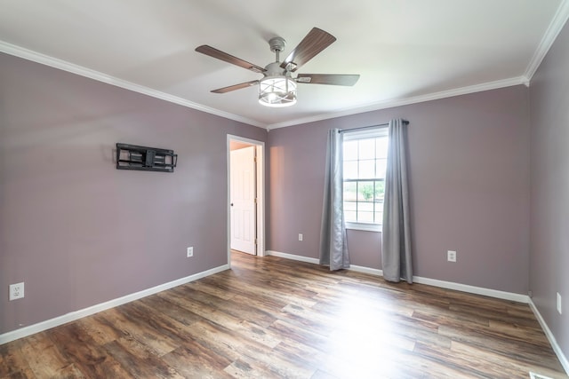 spare room featuring ceiling fan, hardwood / wood-style flooring, and crown molding