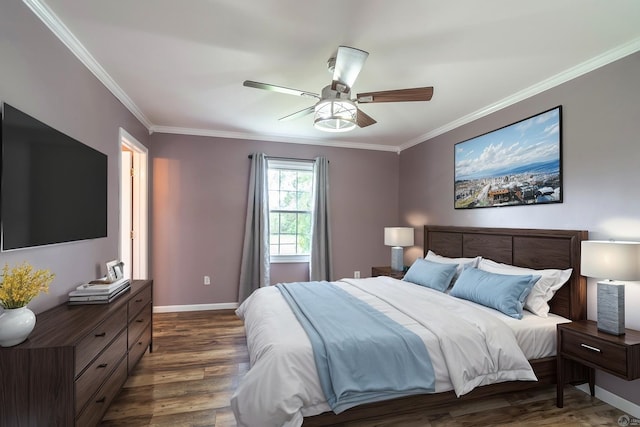 bedroom with ceiling fan, ornamental molding, and dark wood-type flooring