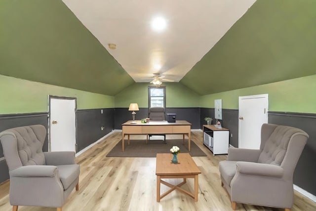 office area with vaulted ceiling, light hardwood / wood-style floors, and ceiling fan