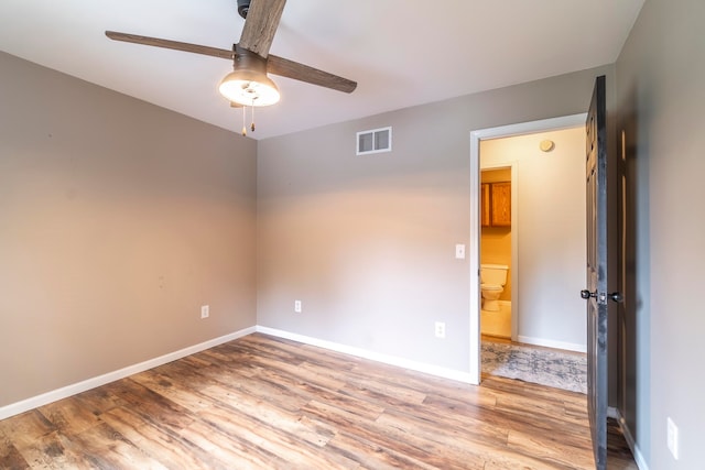 spare room with ceiling fan and light hardwood / wood-style flooring